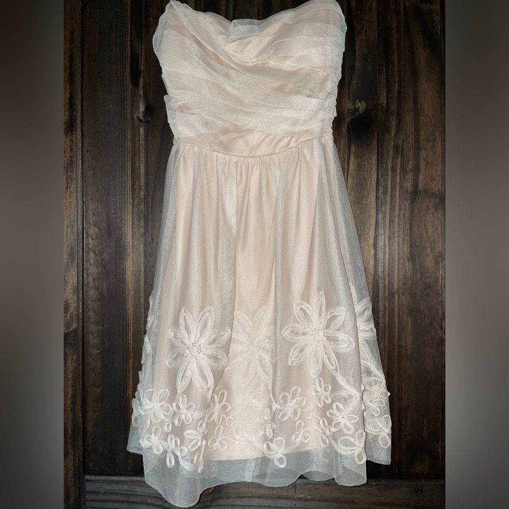 Cream, floral appliqué, lined, strapless dress. New with tags!! Size S